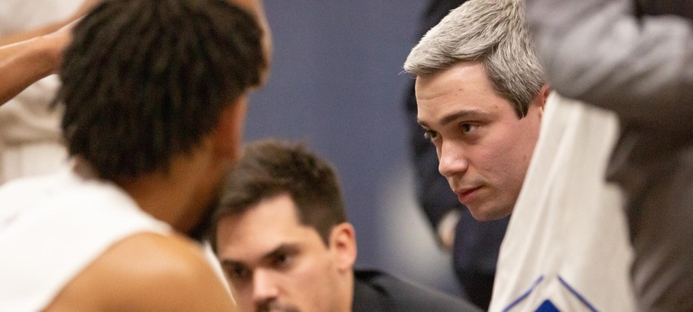 Interim head coach Zach Settembre gives instructions during a timeout (photo courtesy of Michael Schwarz)